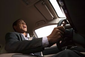 Businessman singing while driving