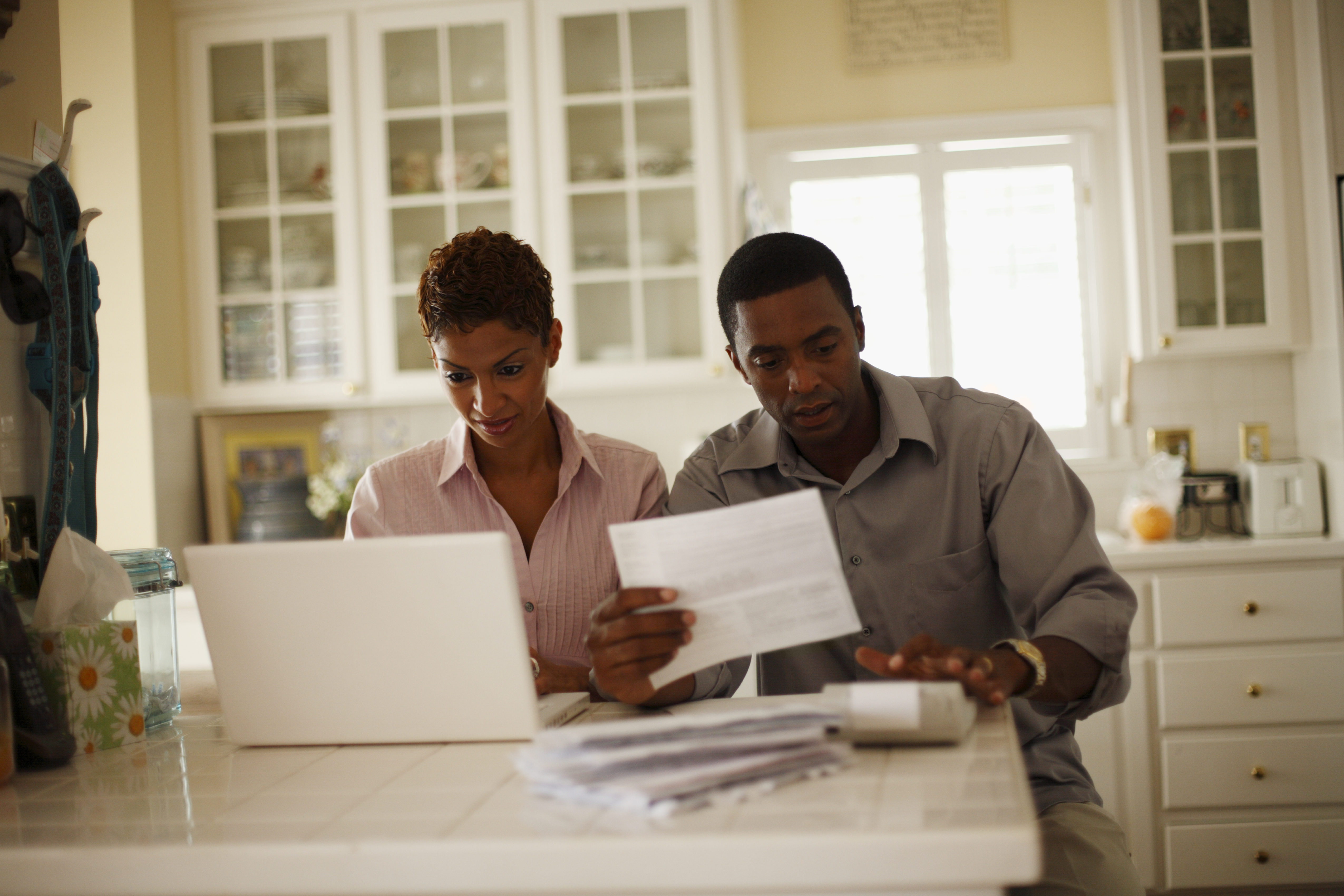 Couple Looking at Bills