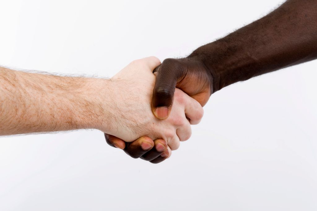 Black and white shaking hands