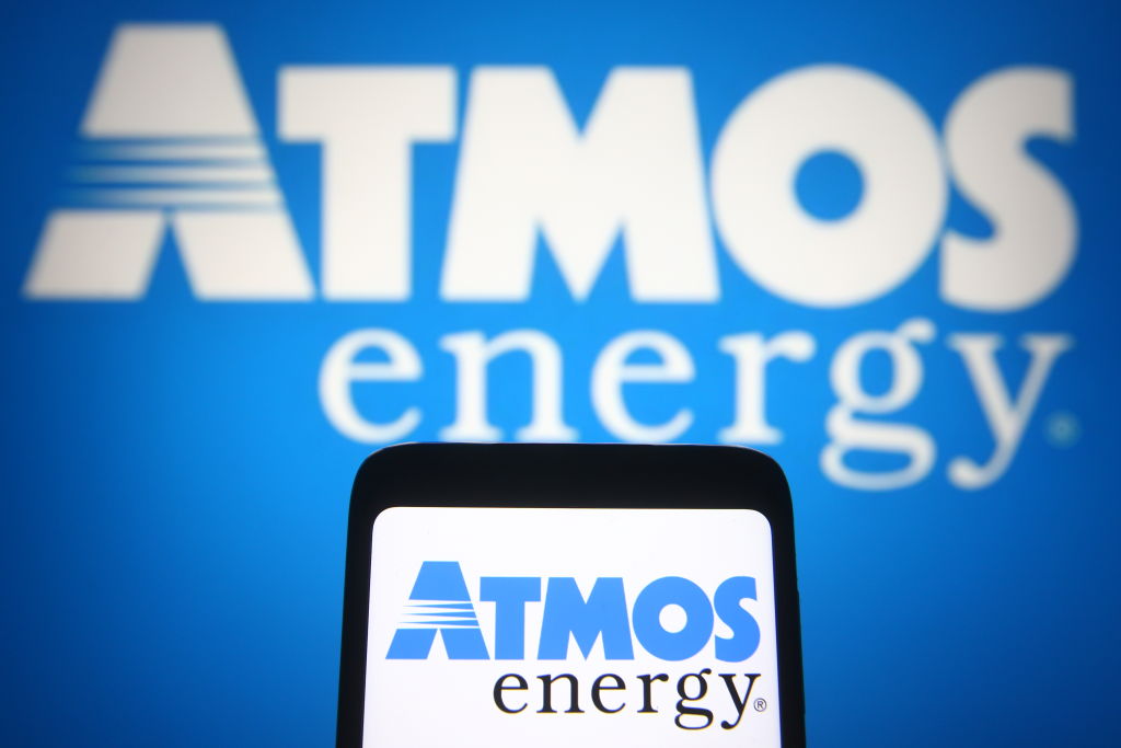 In this photo illustration, Atmos Energy logo of an US...